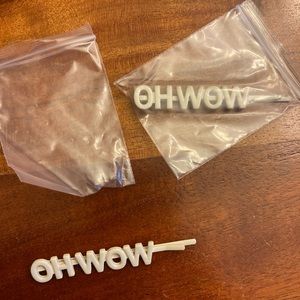 new set of two bobby pins for hair with saying “oh wow”
